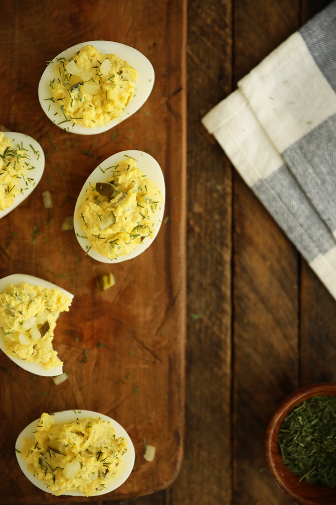 Dill Pickle Deviled Eggs on cutting board