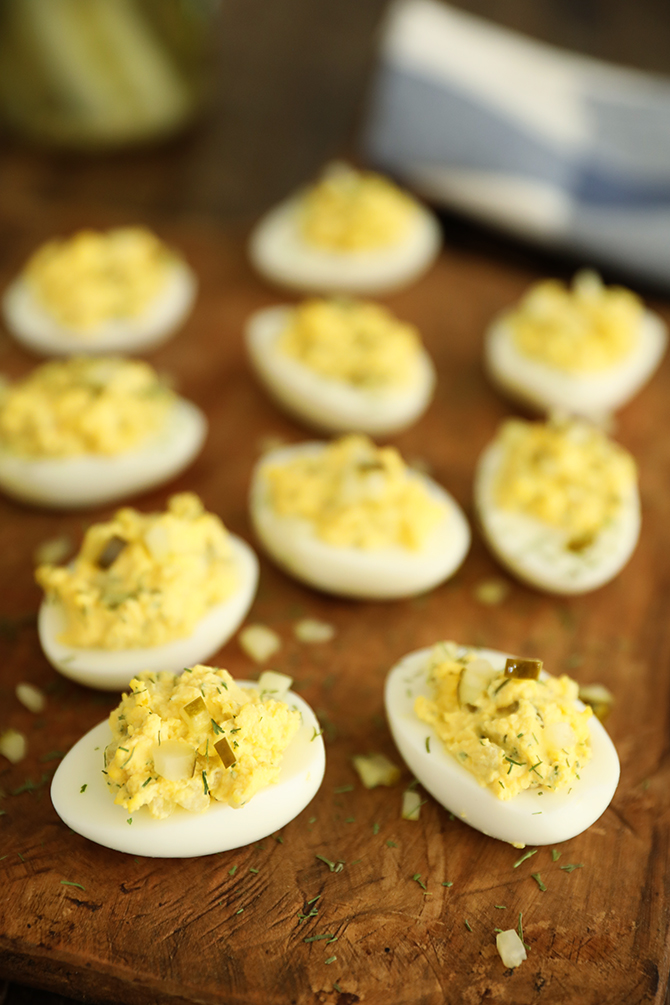 Dill Pickle Deviled Eggs on cutting board