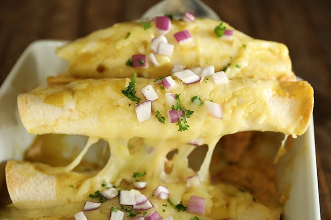2 Creamy Chicken Enchiladas being served