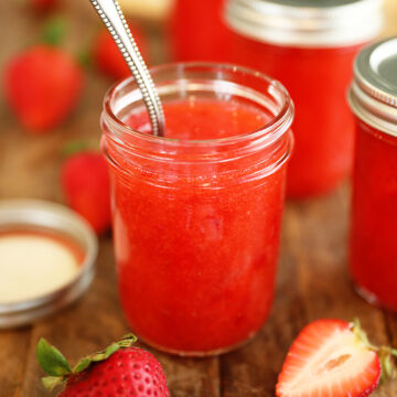 Jar of Easy Strawberry Freezer Jam with spoon