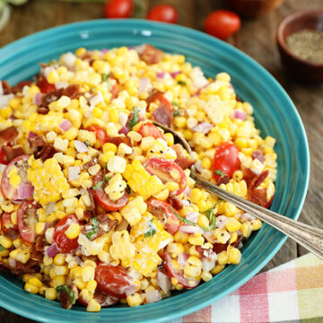 Sweet Corn Salad with Bacon in a teal bowl with a spoon in it