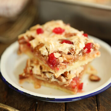 Cherry Coconut Pecan Bars stacked on a plate