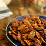 Butter Toasted Pumpkin Spice Pecans on a blue plate