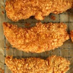 Saltine Crusted Chicken Tenders on a cooling rack