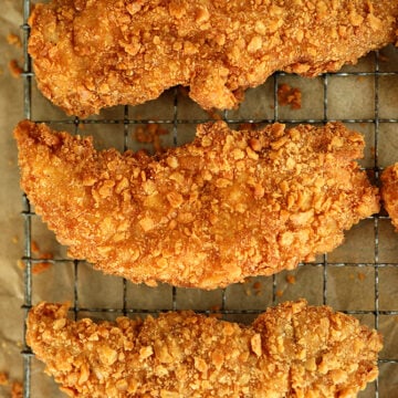 Saltine Crusted Chicken Tenders on a cooling rack