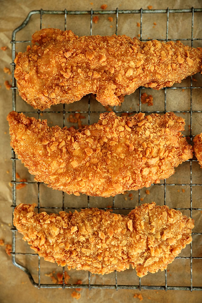 Saltine Crusted Chicken Tenders on a cooling rack