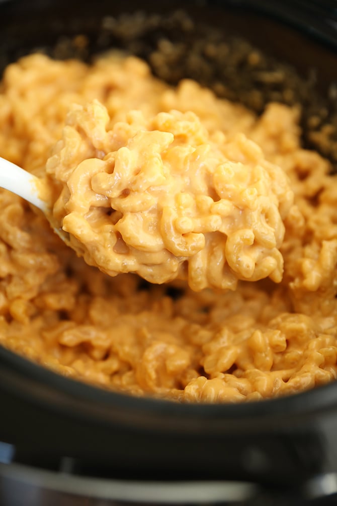 scoop of The Best Crock Pot Mac and Cheese in the slow cooker