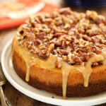 Easy Pumpkin Cheesecake with Pecan Pie Topping with caramel drizzle