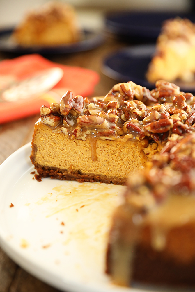 Easy Pumpkin Cheesecake with Pecan Pie Topping with piece missing