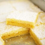 Easy Lemon Squares stacked in metal pan