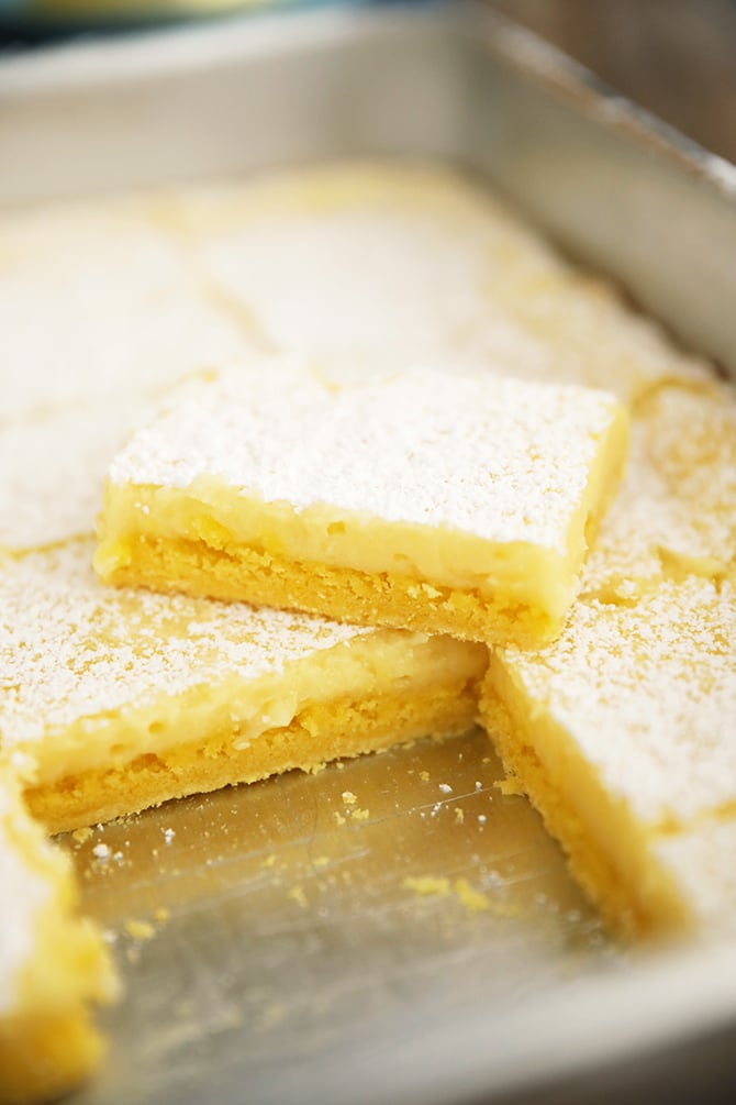 Easy Lemon Squares stacked in metal pan