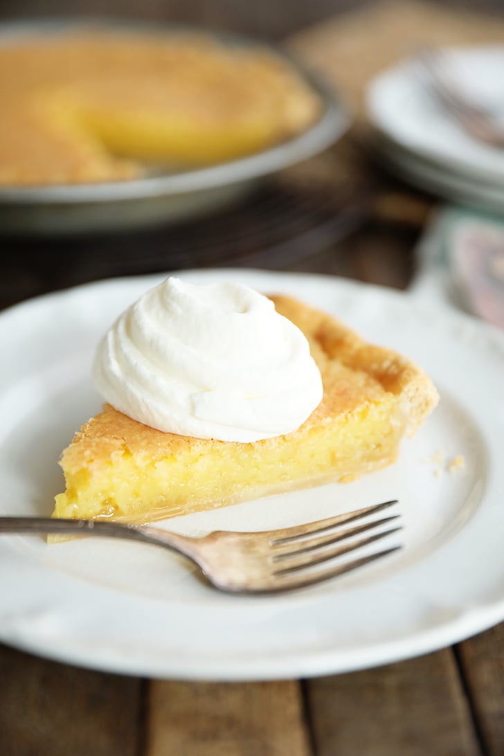 Slice of Old Fashioned Vinegar Pie with whipped cream on top