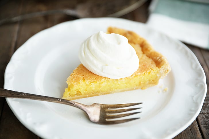 slice of Old Fashioned Vinegar Pie with whipped cream on top