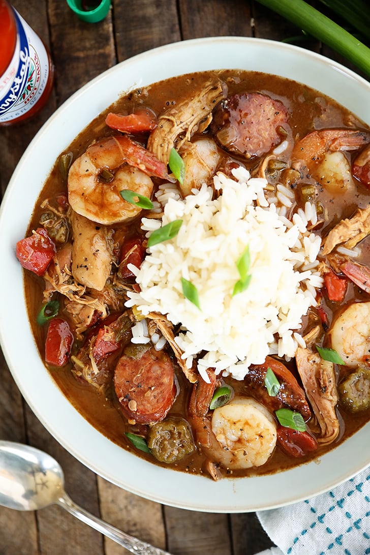 Overhead view of Chicken, Sausage, and Shrimp Gumbo in a bowl with white rice