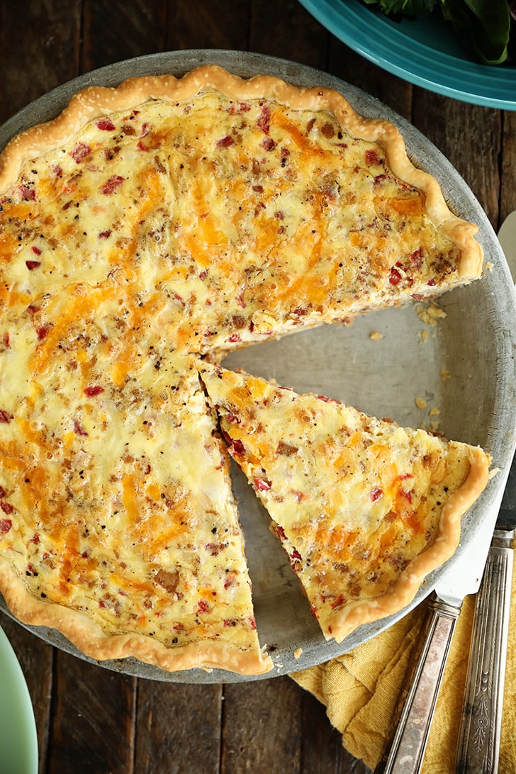 overhead view of Bacon and Pimento Cheese Quiche with slice missing