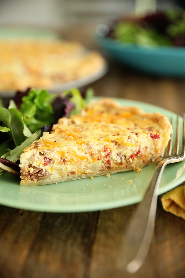 slice of Bacon and Pimento Cheese Quiche on a plate.