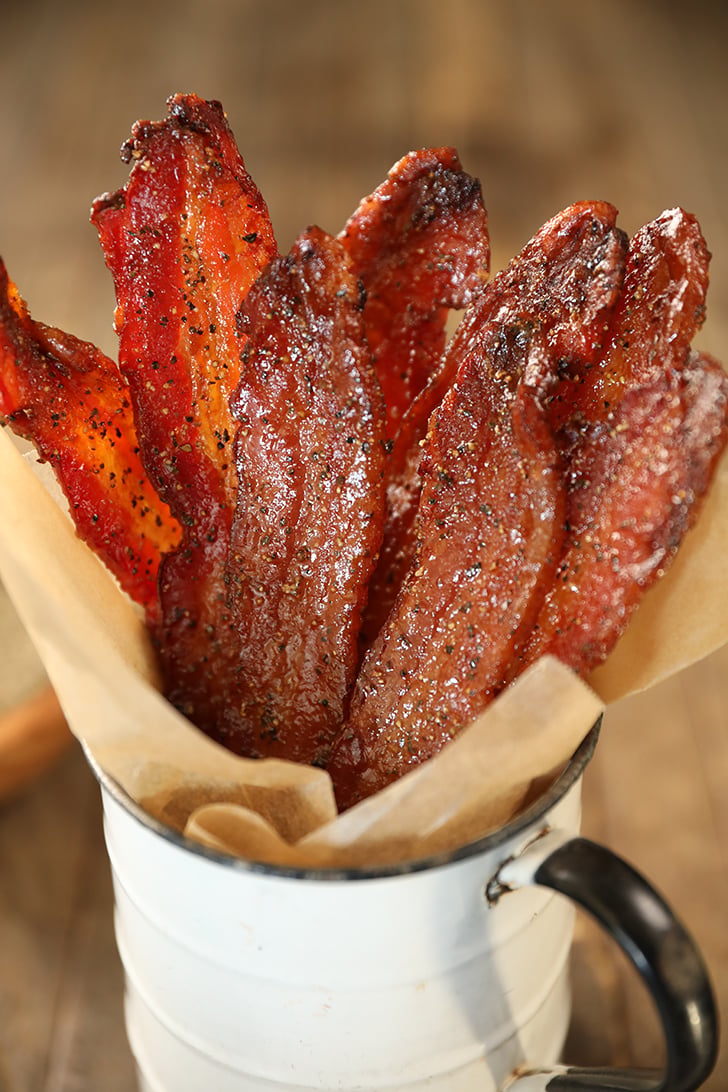 Easy Candied Bacon pieces in a metal cup.