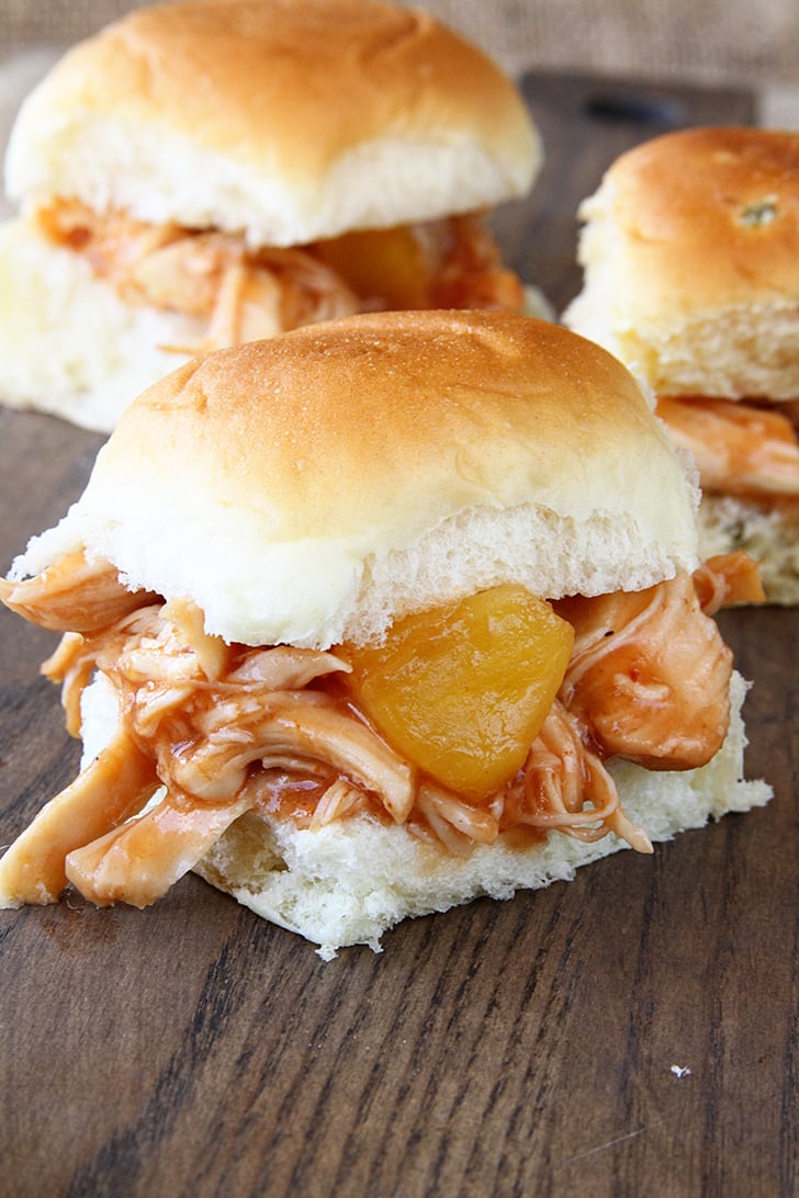Slow Cooker Pineapple Chicken Sliders on a board.