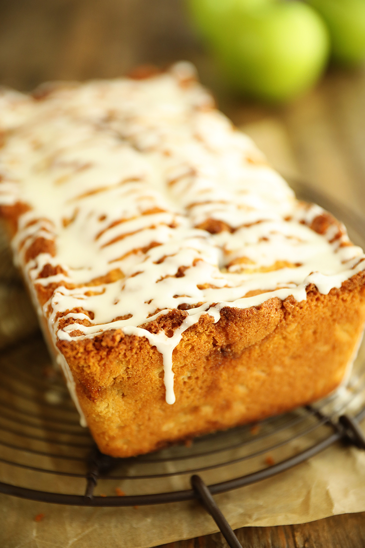 Whole Apple Fritter Bread with powdered sugar drixzzle.