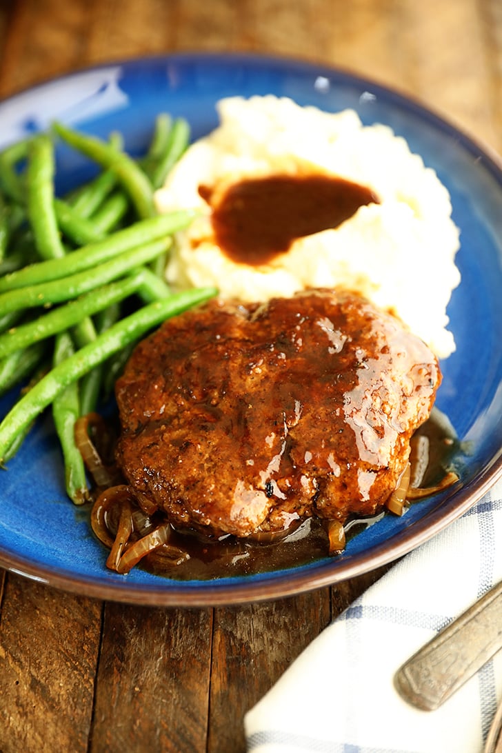 Salisbury Steak on a plate with mashed potatoes.