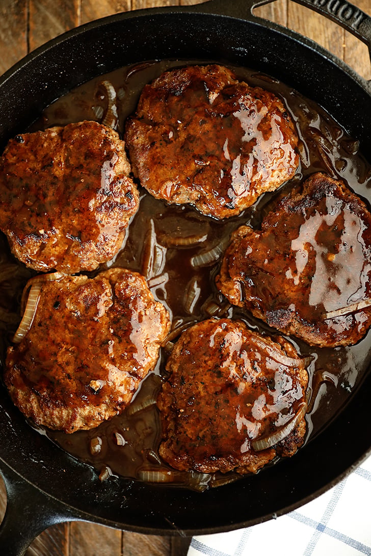 Salisbury Steak in a skillet.