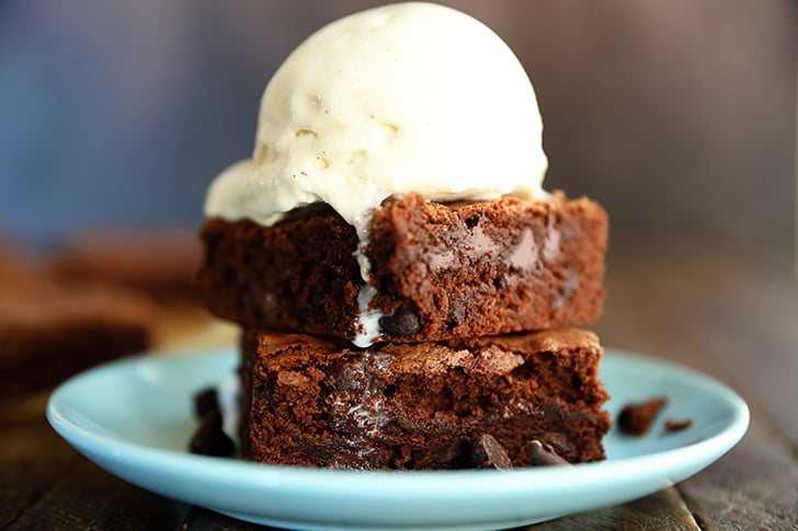 two brownies with ice cream on top.