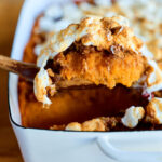 Sccop of Ultimate Sweet Potato Casserole.
