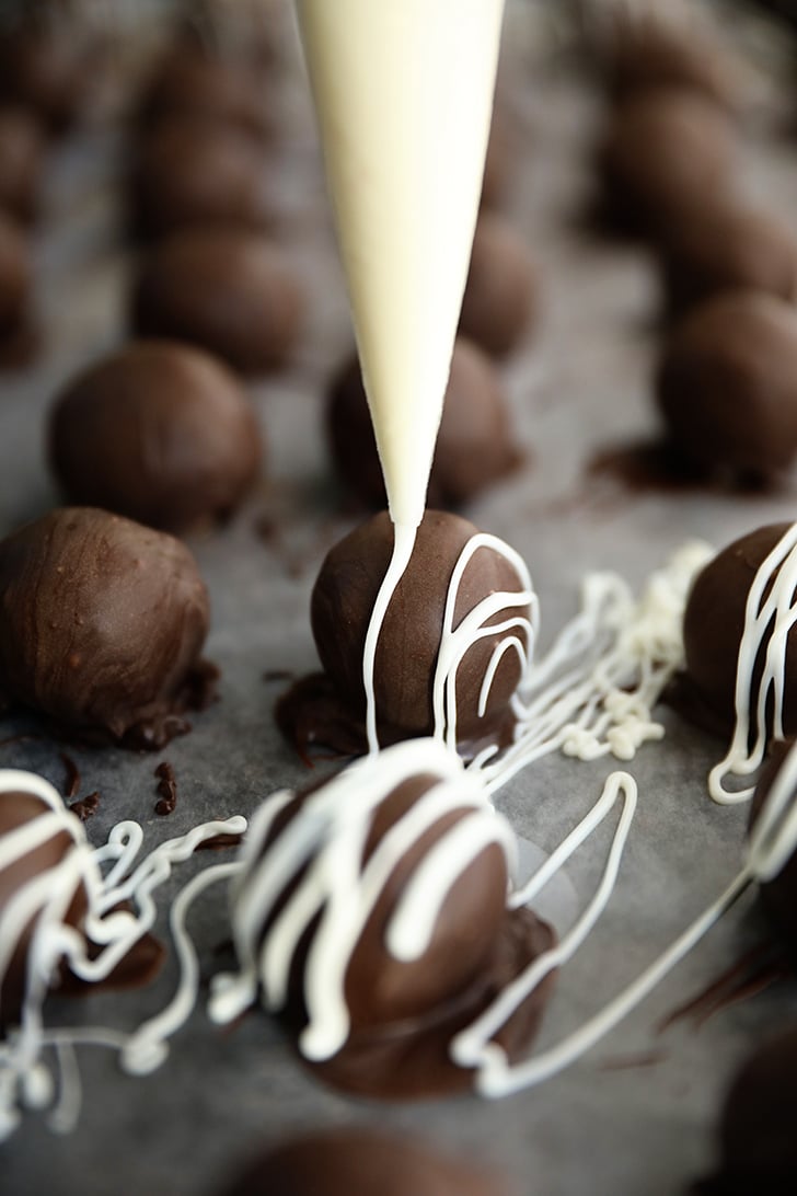 Drizzling white chocolate on Martha Washington Candy.