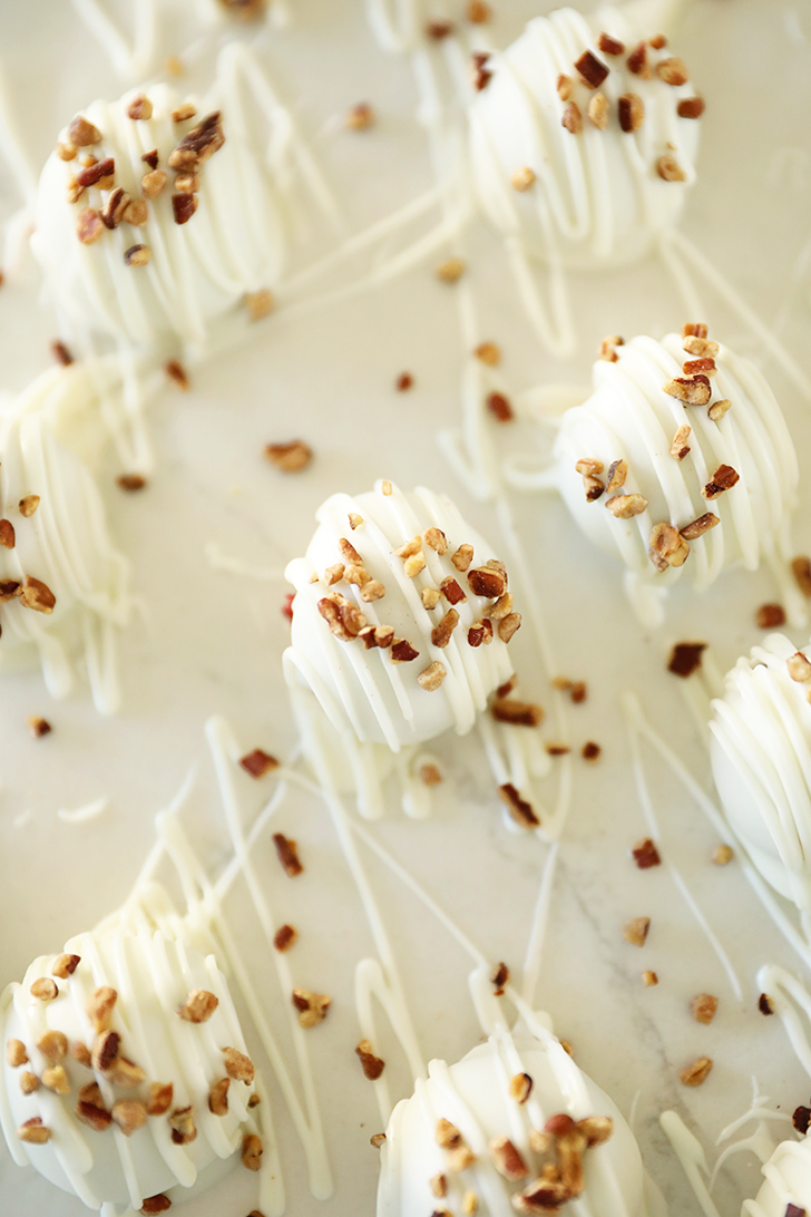 Overhead view of Red Velvet Cake Truffles on wax paper.