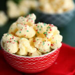 Candied Puff Corn in a small red bowl.
