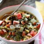 Quick and Easy Potlikker Soup in a white bowl.
