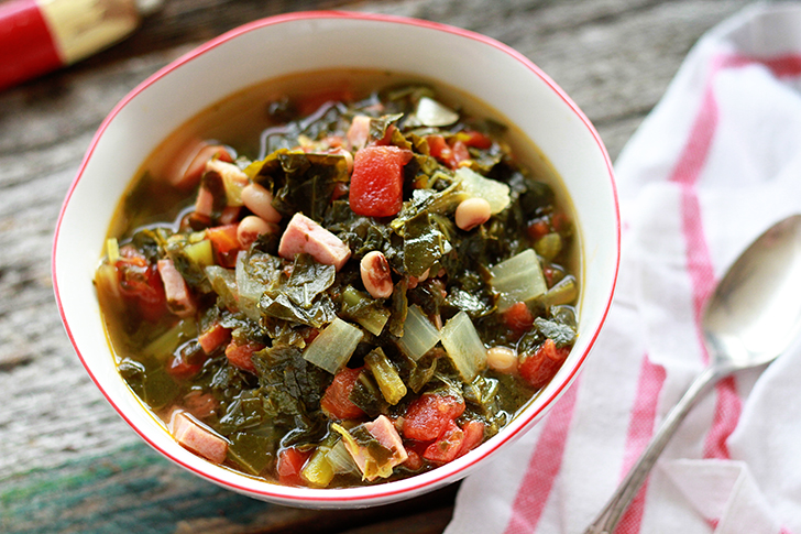 Overhead view of Quick and Easy Potlikker Soup in a white bowl.