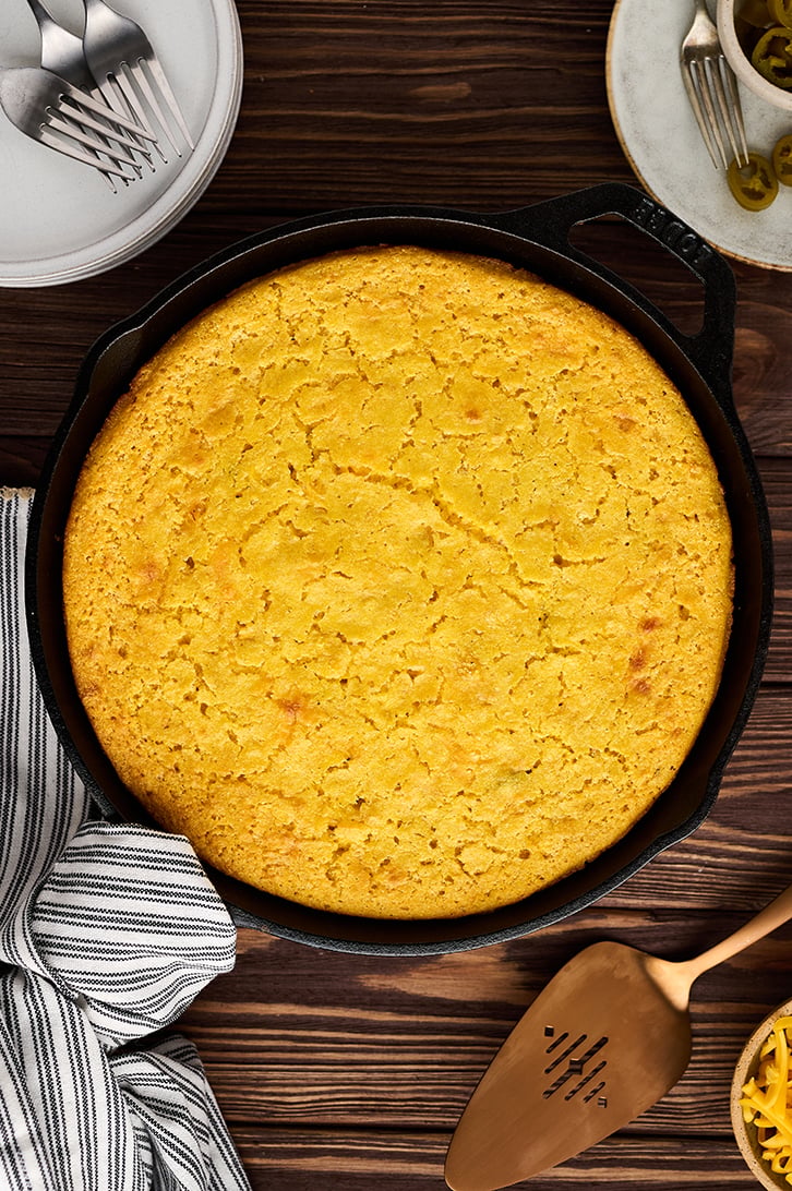 Overhead view of cast iron skillet with Mexican Cornbread.