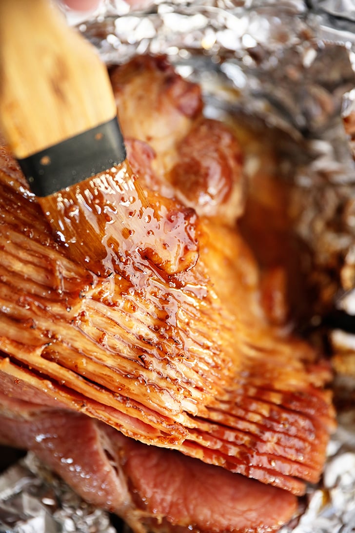 Brown Sugar Pineapple Ham Glaze being brushed over ham.