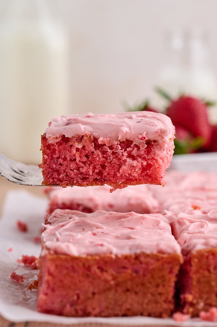 Slice of Strawberry Sheet Cake on server.