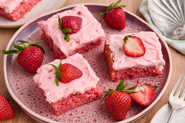 Slices of Strawberry Sheet Cake.