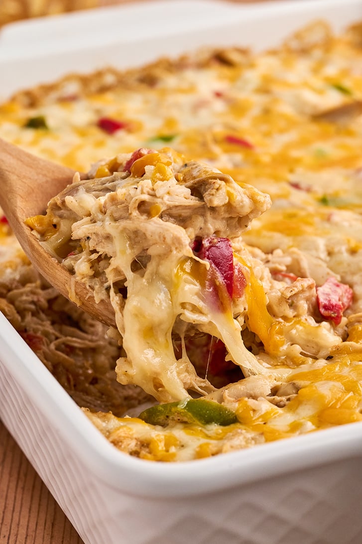 Scoop of Chicken Fajita Casserole in casserole dish.