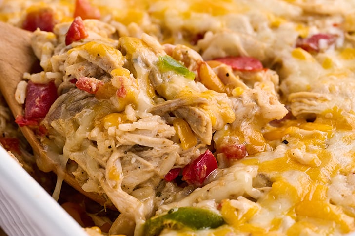 Scoop of Chicken Fajita Casserole in casserole dish.