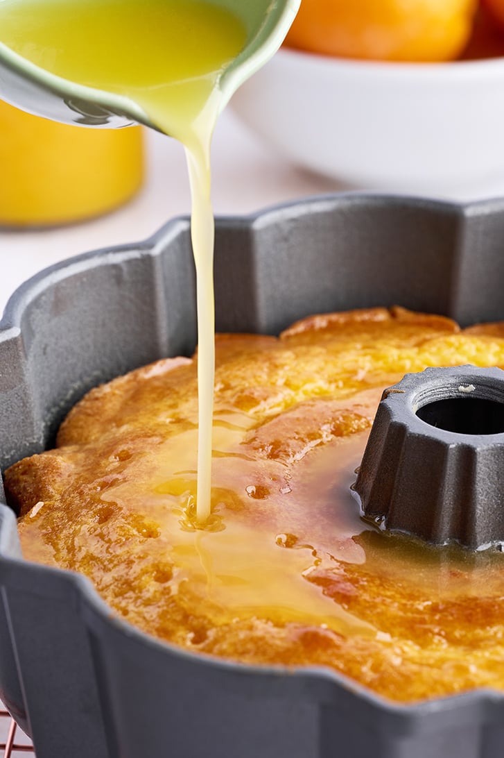 Glaze pouring on Orange Juice Cake.