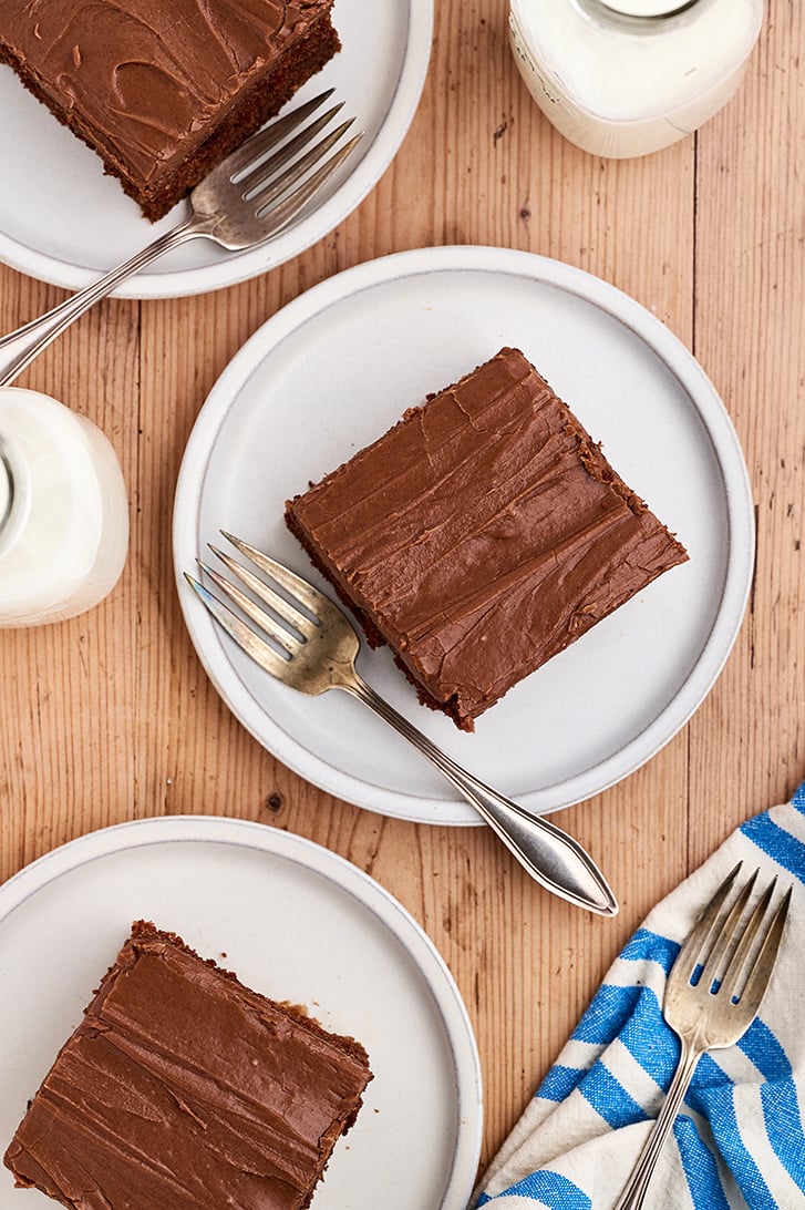Pieces of Buttermilk Chocolate Cake on white plates.