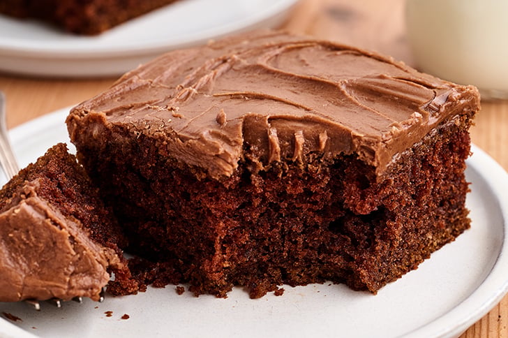 Piece of Buttermilk Chocolate Cake with bite missing.