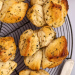 Shortcut Garlic Herb Pull-Apart Rolls on a wire rack.