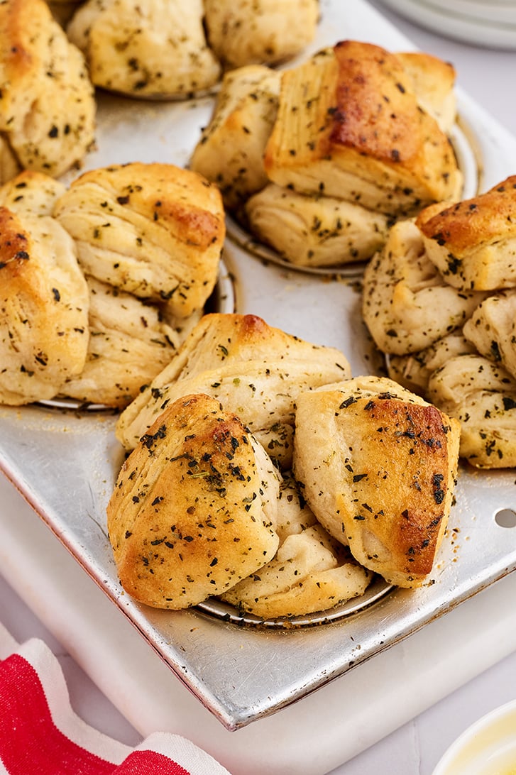 Shortcut Garlic Herb Pull-Apart Rolls in muffin pan.