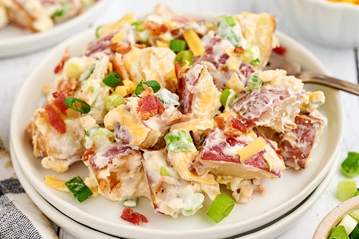 Loaded Baked Potato Salad on a white plate.