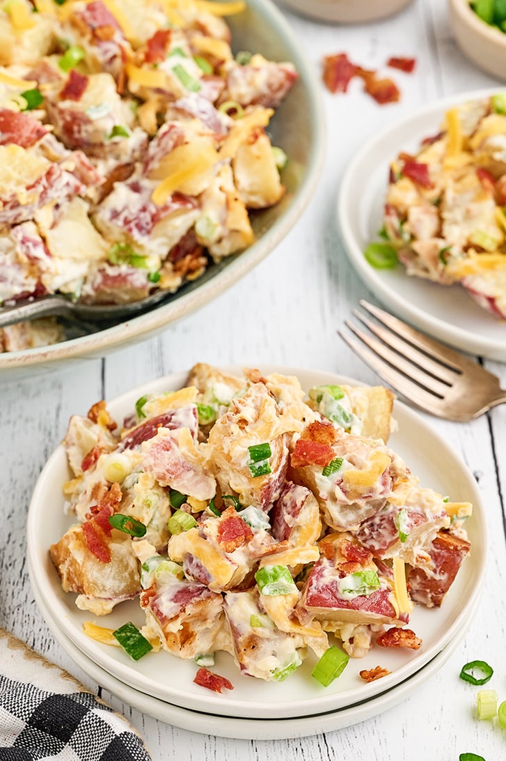 Loaded Baked Potato Salad on a white plate.
