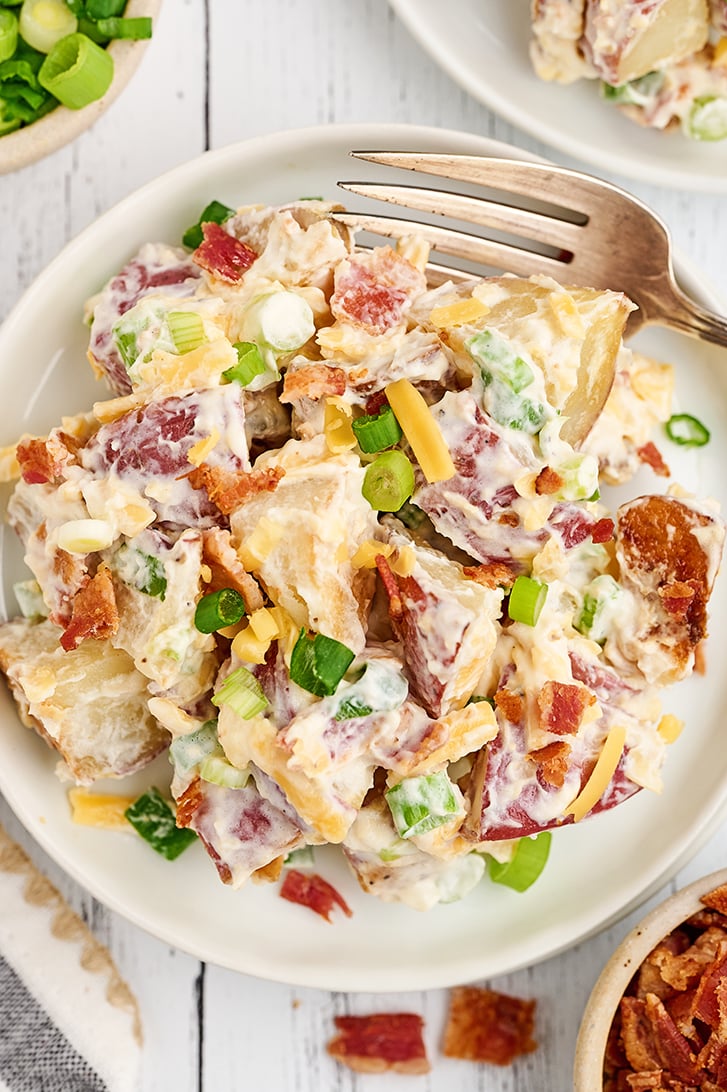 Loaded Baked Potato Salad on a white plate.