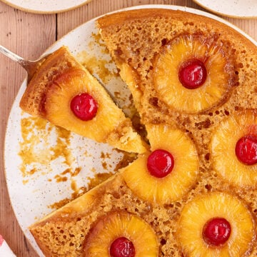 Overhead view of Skillet Pineapple Upside-Down Cake with slice missing.