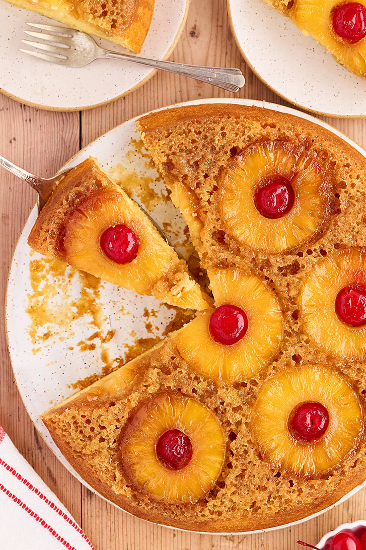 Overhead view of Skillet Pineapple Upside-Down Cake with slice missing.