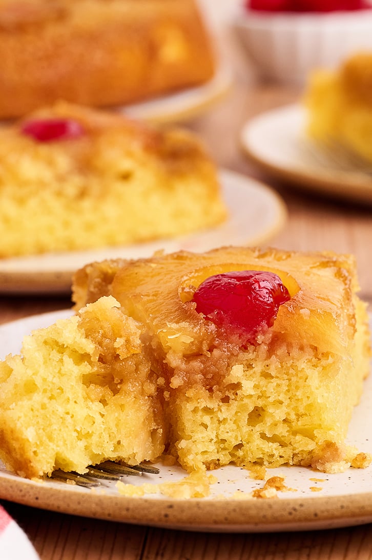 Piece of Skillet Pineapple Upside-Down Cake with bites missing.