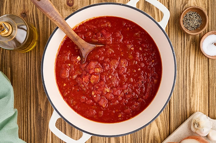 Homemade Marinara Sauce in white pot.